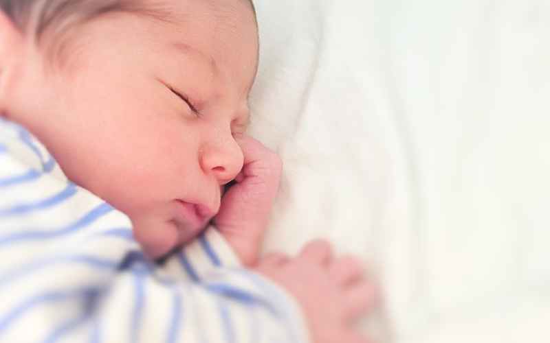Newborn care services by New Life Doulas has baby sleeping soundly